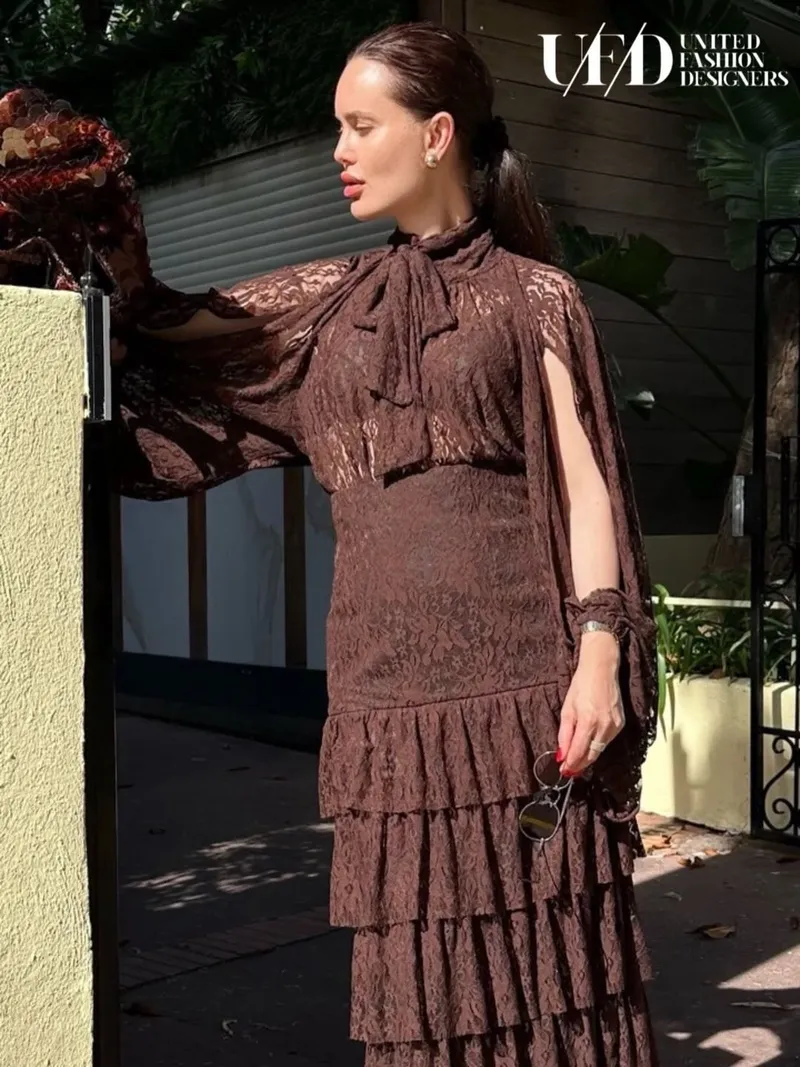 Chocolate lace pussy-bow blouse with cape sleeve and tiered lace skirt